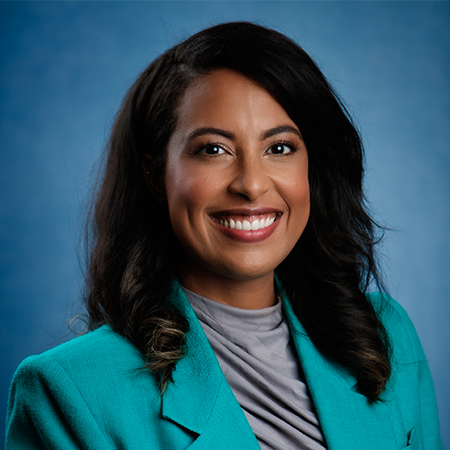 Professional portrait of Sigrid Vendrell-Polanco in a green jacket.