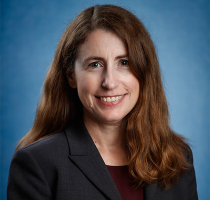 Professional portrait of Jennifer Stevenson in dark jacket and blouse