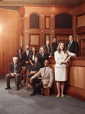 Law staff and faculty posing in room