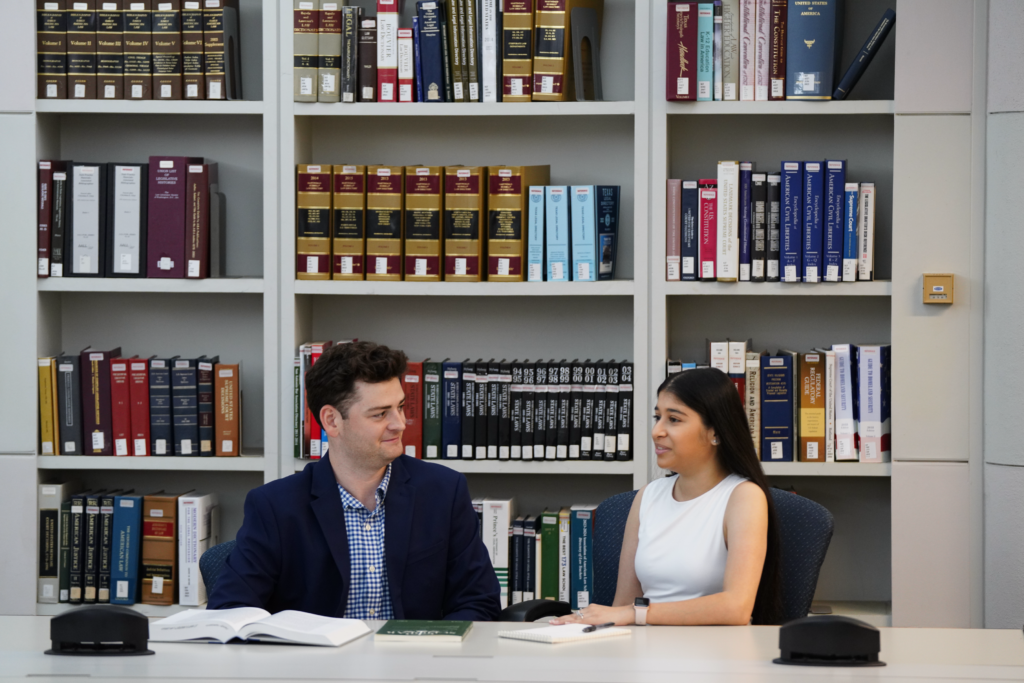 Two students sitting at a table.