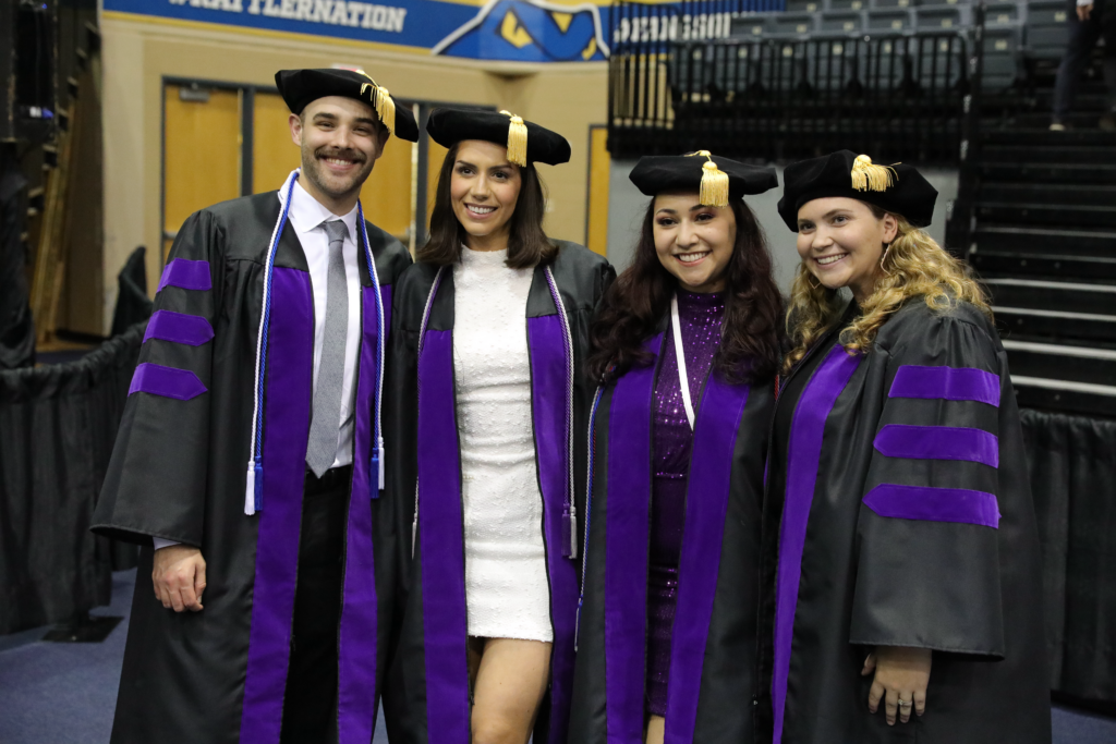 Four law students at commencement