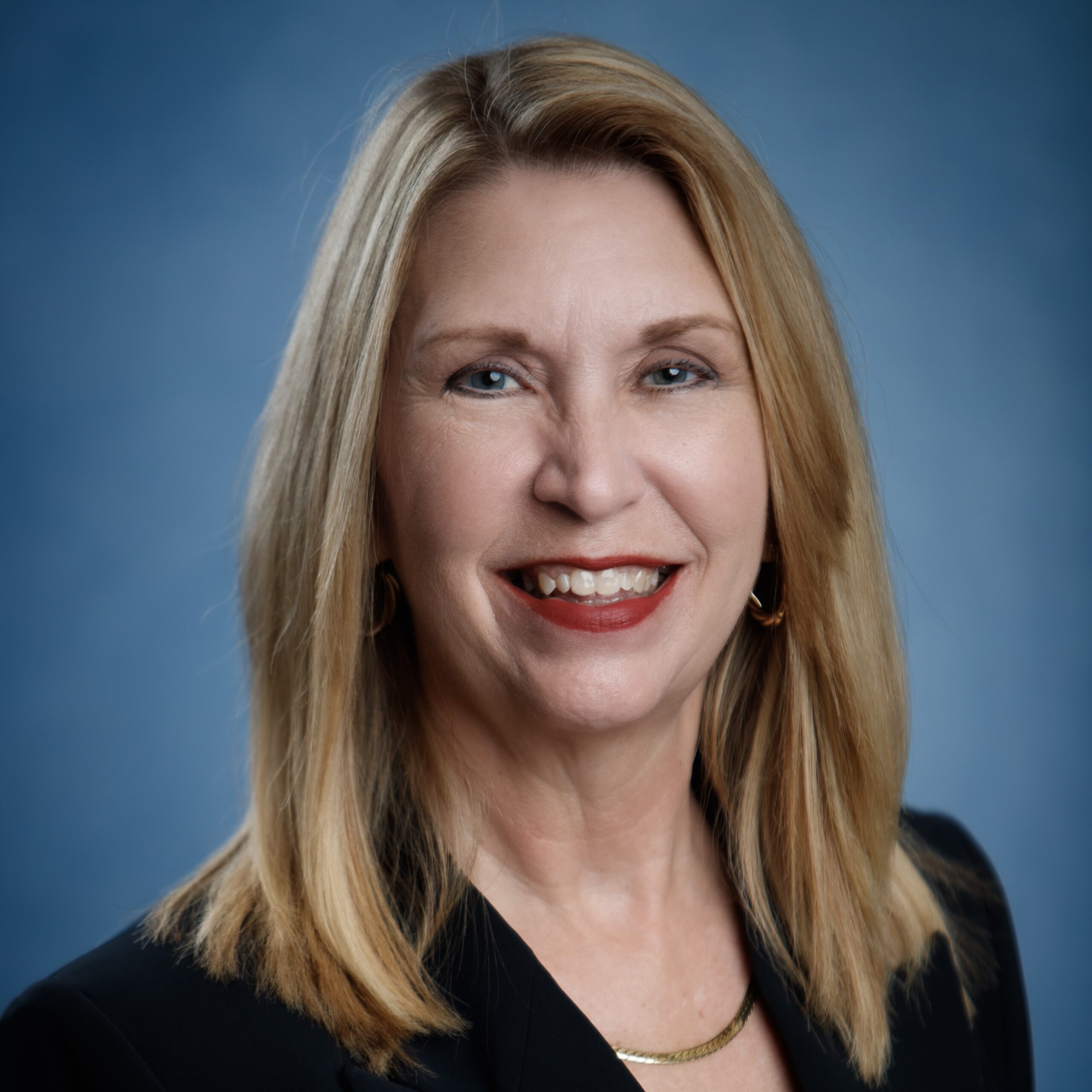 Professional photo of Jana Powell in a black jacket.