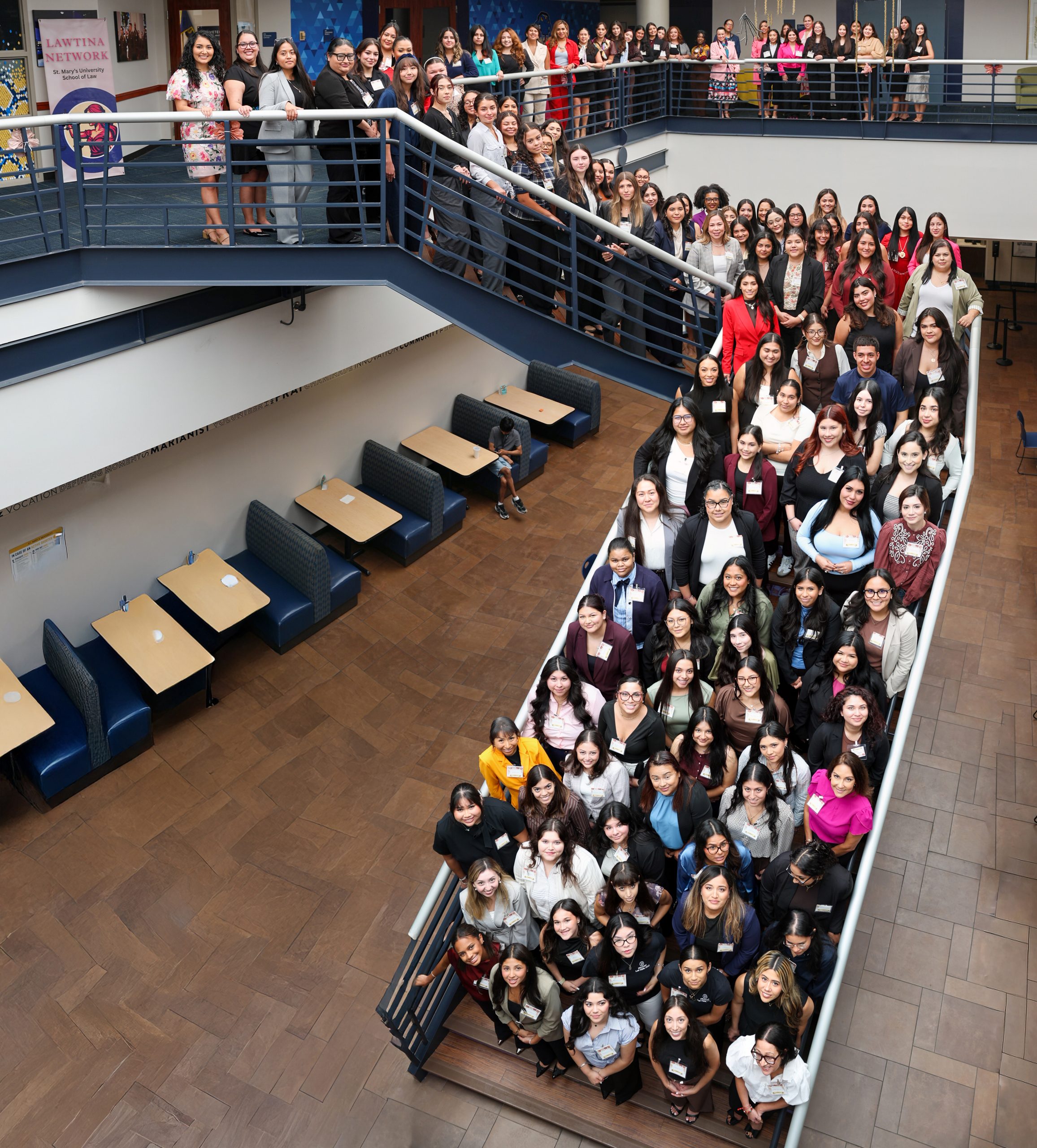 Large group photo on a two-story stairwell of the organizers and attendees of the fifth annual Lawtina Network Summit on Sept. 19, 2026.